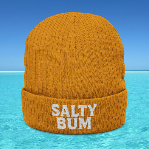 Orange beanie with 'Salty Bum' text on a blue water and sky background