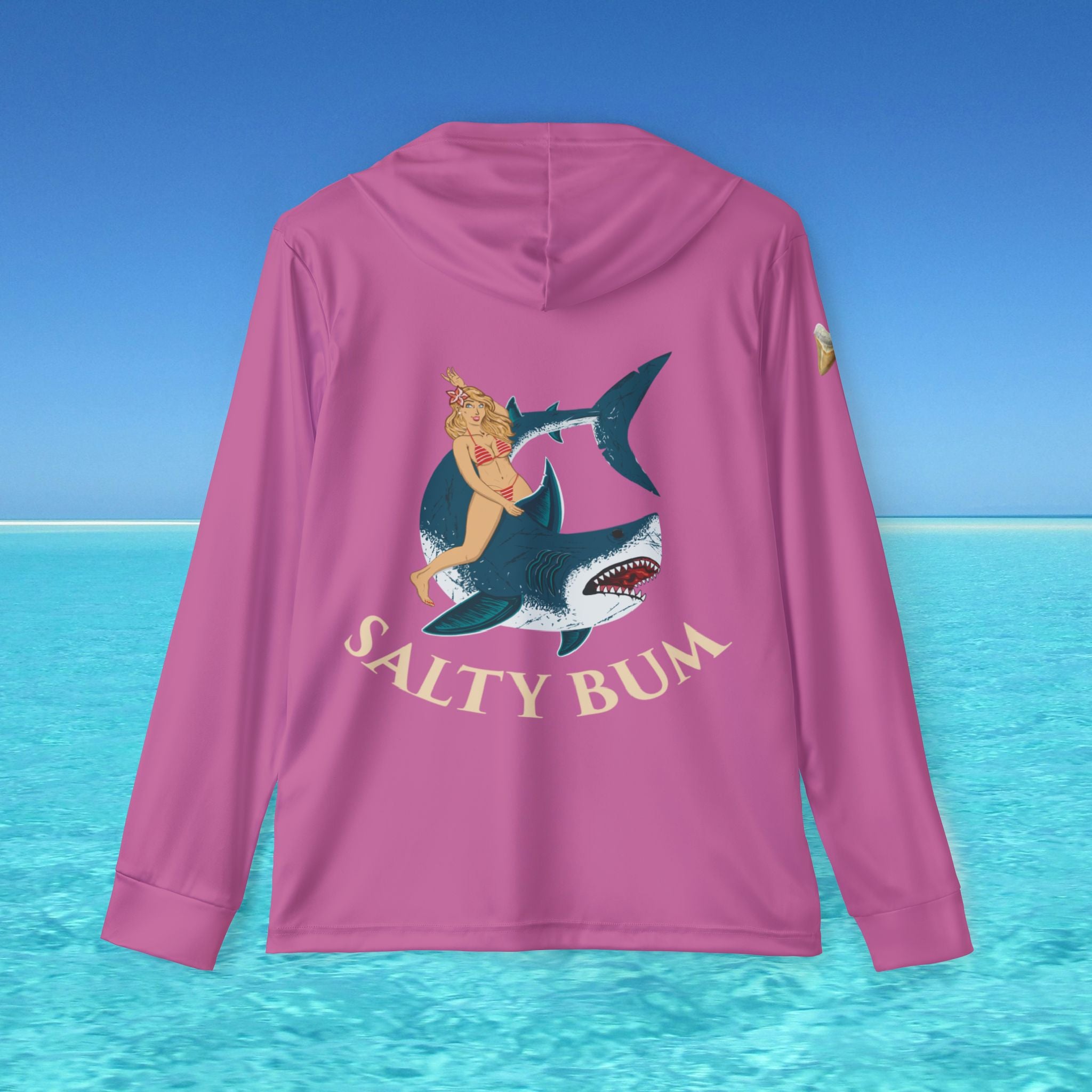 Pink hoodie with a shark and mermaid graphic and 'Salty Bum' text on a blue ocean background