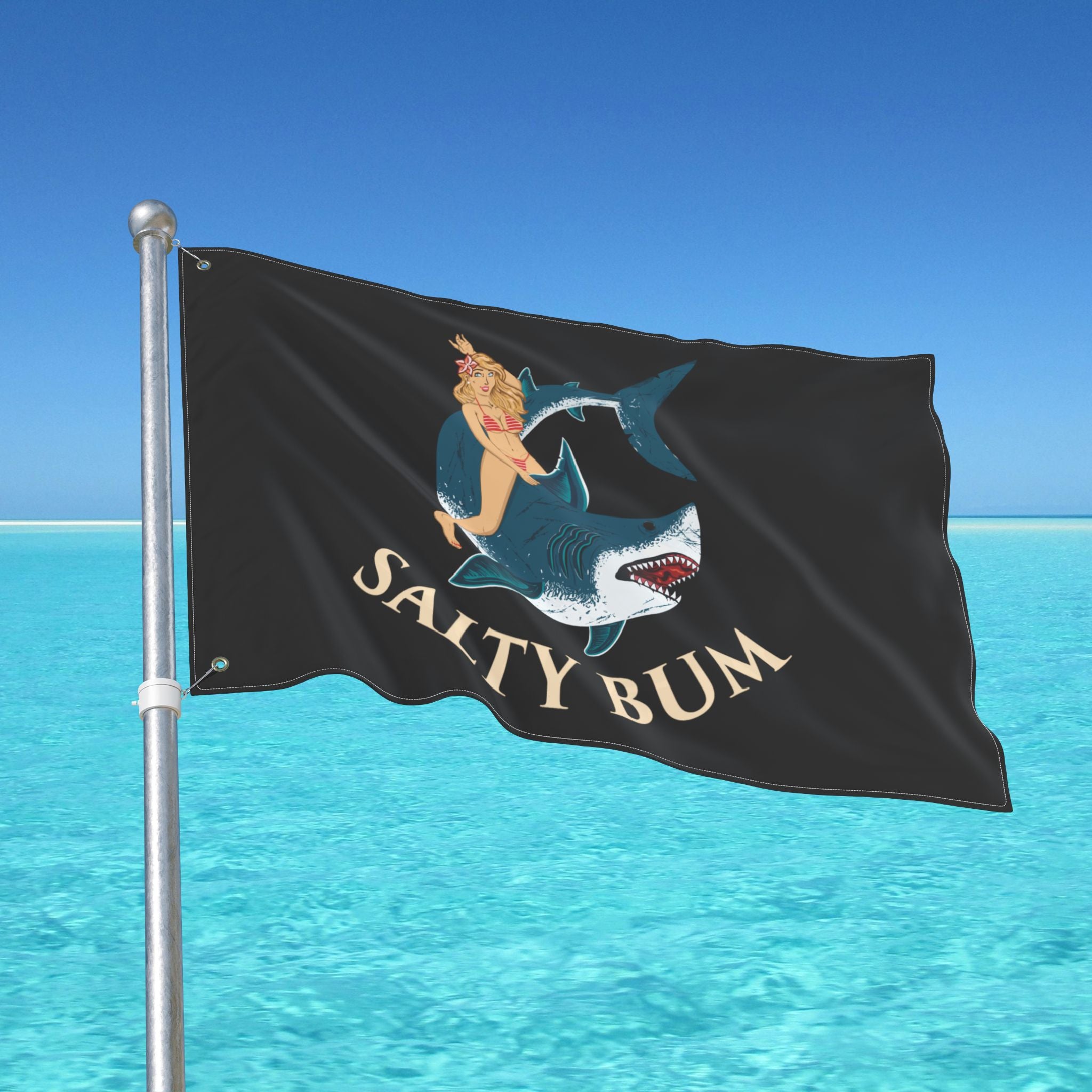 Flag with 'Salty Bum' design on a pole over clear blue water